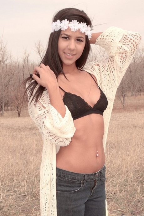 Pretty Latina girl Bella Quinn poses outdoors in a black bra and jeans 70066433