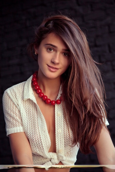 Solo model Raia confidently displays her naked beauty on a red sofa 89651686