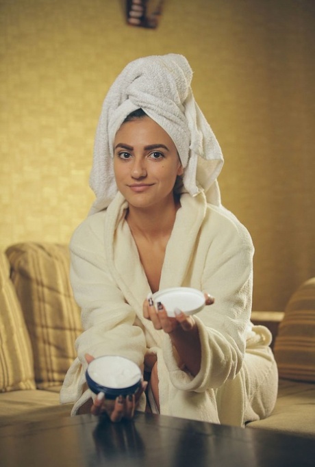 Exotic teen girl Cira Nerri rubs in lotion in a robe and towel 89397335