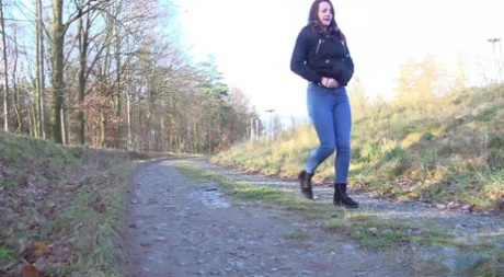 White girl Amanda Hill pulls down her jeans to pee on a gravel road 80381935